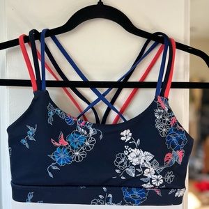 GAPFIT medium impact sports bra navy floral cross strap detailing